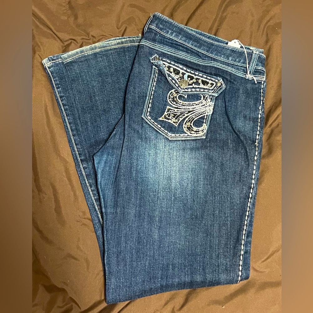 Rock 47 jeans with fleur-de-lis design on pocket